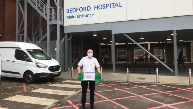 NHS worker outside Bedford Hospital