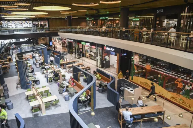 Finnish people enjoy the easing of restrictions by going out in Tripla shopping mall in Pasila railway station in Helsinki