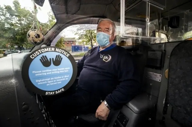 Taxi driver wearing a mask