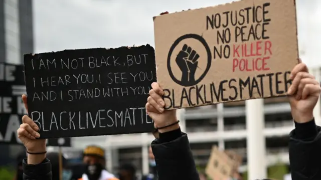 Placards at protest in Birmingham