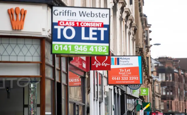 For sale signs at shops in the West End of Glasgow