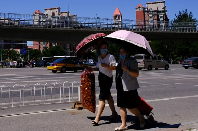 People are seen wearing masks in Beijing