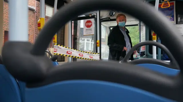 A passenger wearing a face mask on a bus in Newcastle