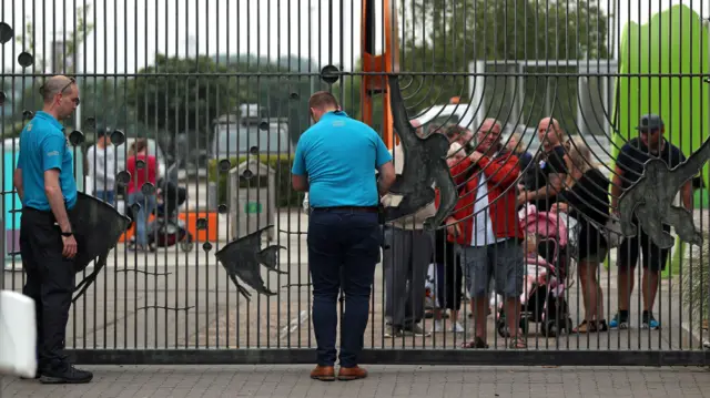 Staff reopen the gates of Chester Zoo to a queue of visitors