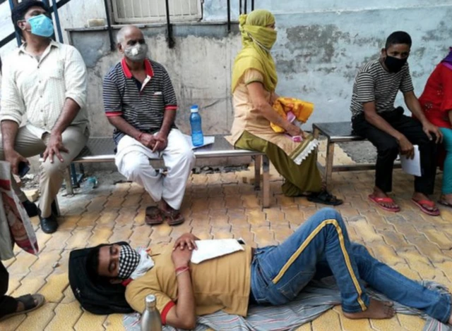 Indians wearing masks on a street