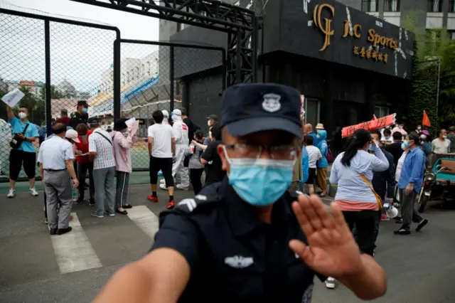 People wait at sports centre to be tested after an unexpected spike of cases of the coronavirus disease (COVID-19) in Beijing, China June 15, 2020