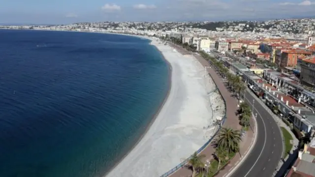 Image shows an empty beach in Nice, France