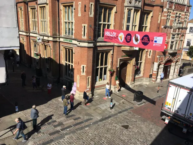 Shoppers queueing