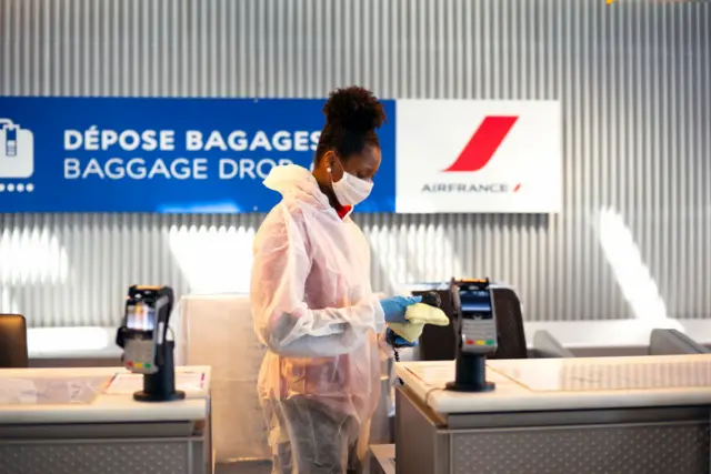 An airport maintenance employee wearing a face mask in Paris