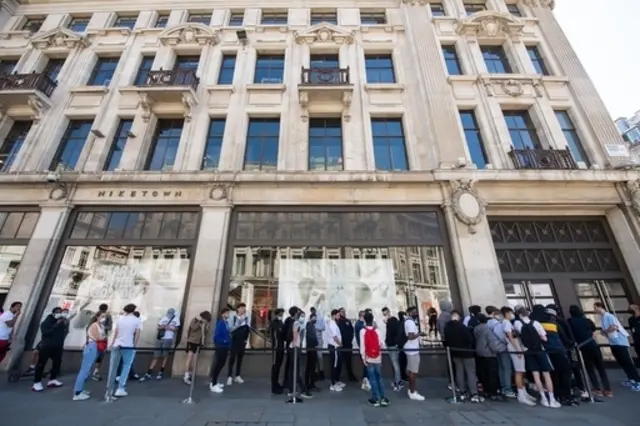 People queue outside Nike Town on Oxford Circus, London