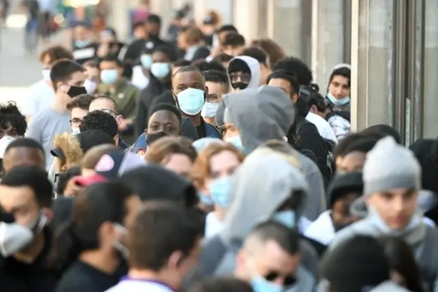 People queueing outside the Nike Town store at Oxford Circus