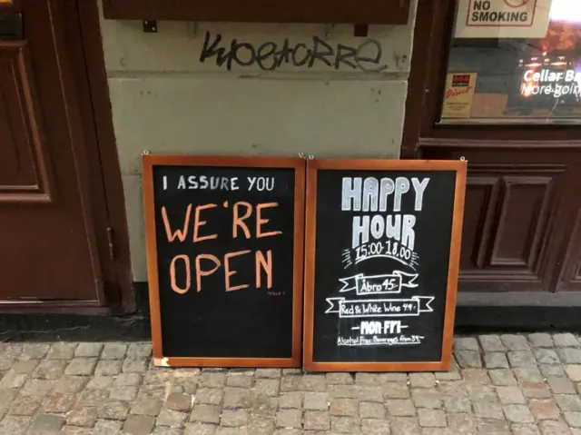 A bar in Stockholm, Sweden tells customers it is open