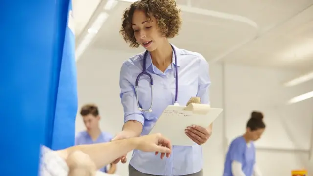 Doctor assessing patient in hospital