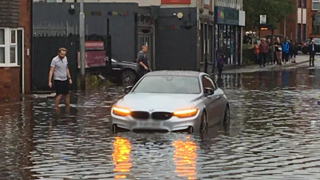 Car trapped by flood water