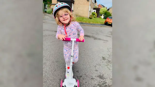 Tilly on her scooter