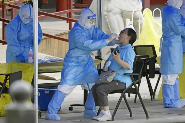 People take a PCR test in Beijing on June 17, 2020