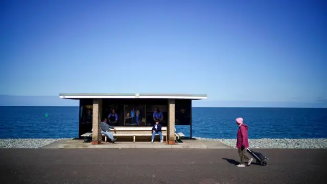 People social distancing on Llandudno promenade