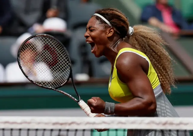 Serena Williams of the US celebrates her victory over Alize Lim of France during their women"s singles match at the French Open at Roland Garros in Paris