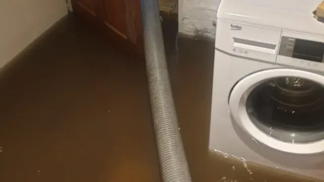 Floodwater around washing machine