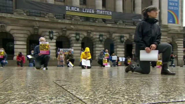 Black Lives Matter protesters kneel in Market Square, Nottingham