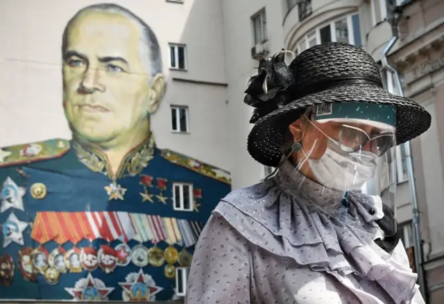 A woman wears a mask in Moscow 16 June