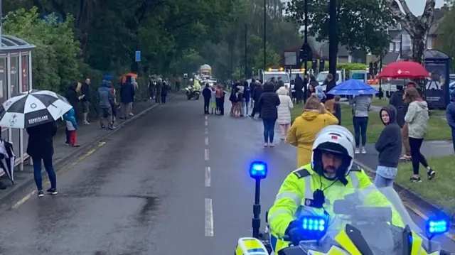 Crowd along part of the route waiting for the cylinder