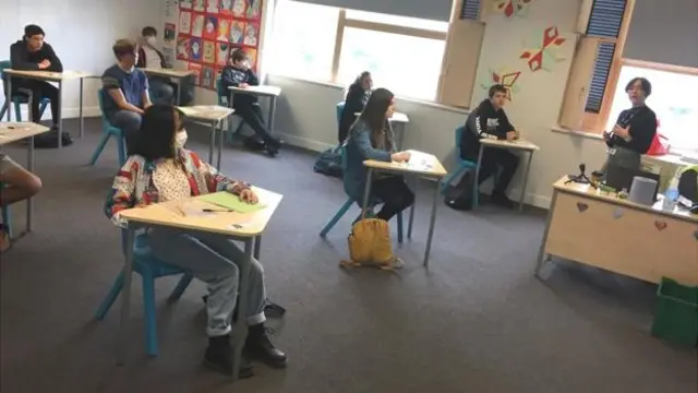 Children sit in a classroom