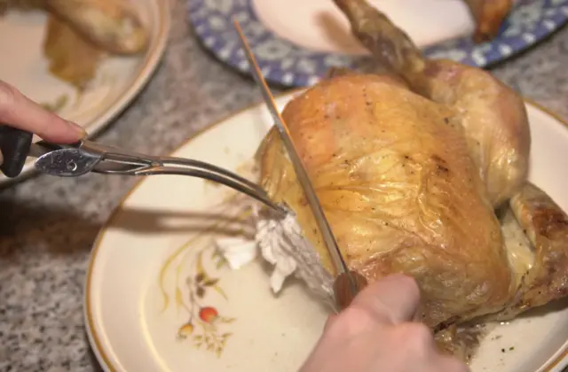 A roast chicken being carved