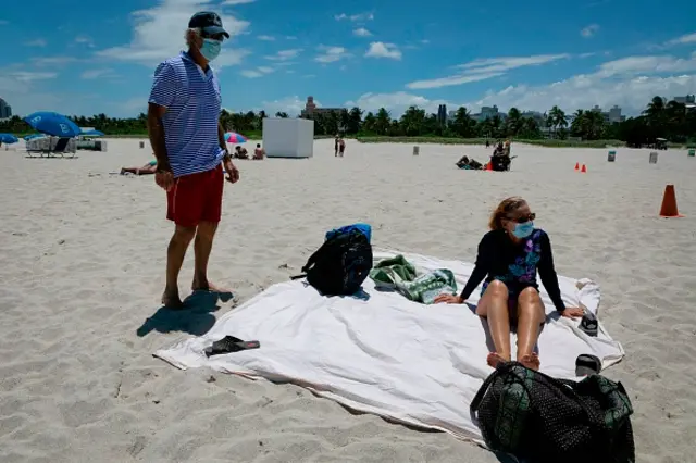 People sunbathing at a beach in Miami, Florida