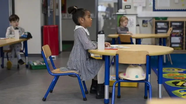 Children sit at individual desks during a lesson at the Harris Academy"s Shortland"s school on June 04, 2020 in London, England