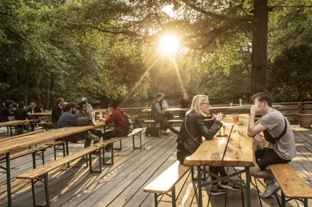 People sit in a beer garden in Berlin