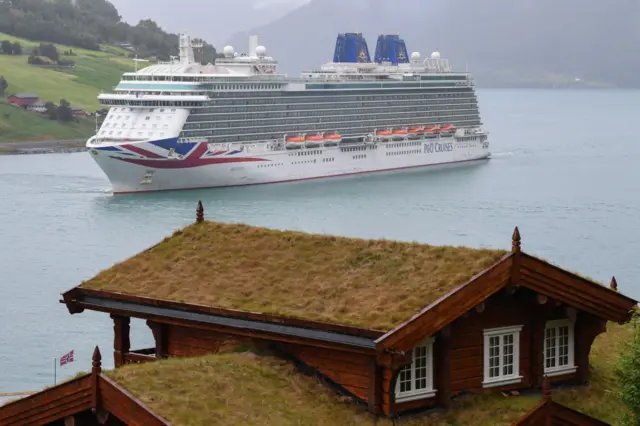 Britannia, the flagship of the P&O Cruises fleet, arriving into Norwegian port Olden wharf in August 2019