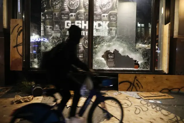 A looted watch store in Broadway, Manhattan