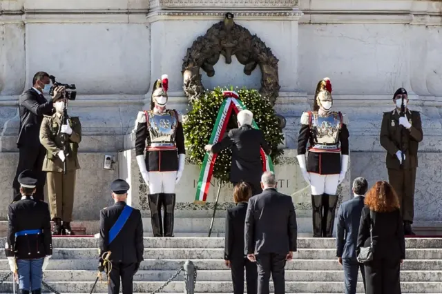 Soldiers pictured wearing a mask at Italy's National Day celebrations