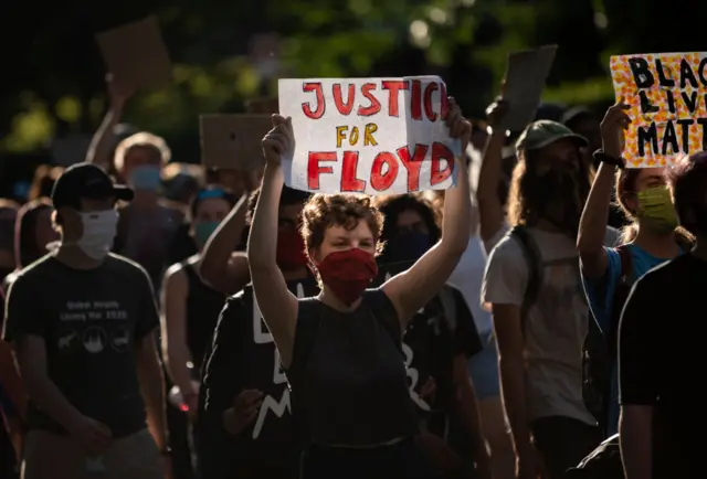 Protesters march from the Governor's Mansion to the Minnesota State Capitol