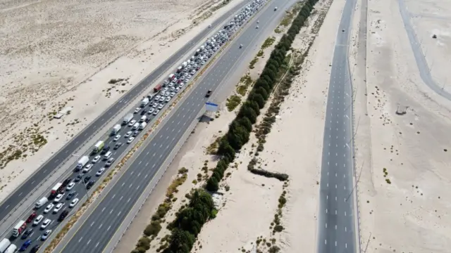 Queues of traffic at a security checkpoint between Abu Dhabi and Dubai