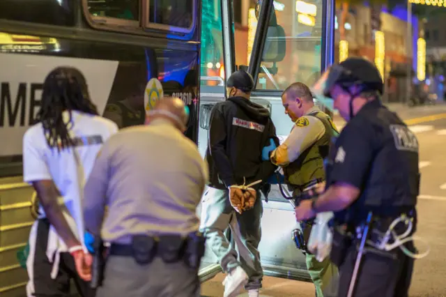 Arrestees are loaded onto a sheriffs bus to be taken to jail as large numbers of people are arrested after a curfew went into effect during demonstrations over the death of George Floyd on June 02, 2020 in the Hollywood section of Los Angeles, California.