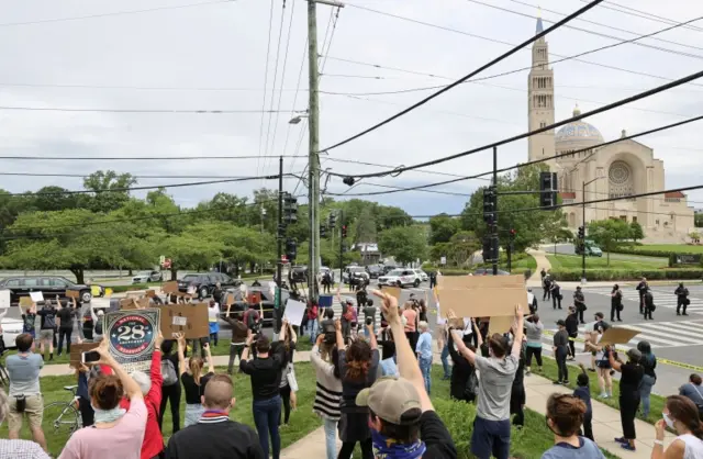 Protesters as motorcade passes