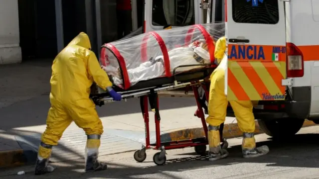 Medics with coronavirus patient