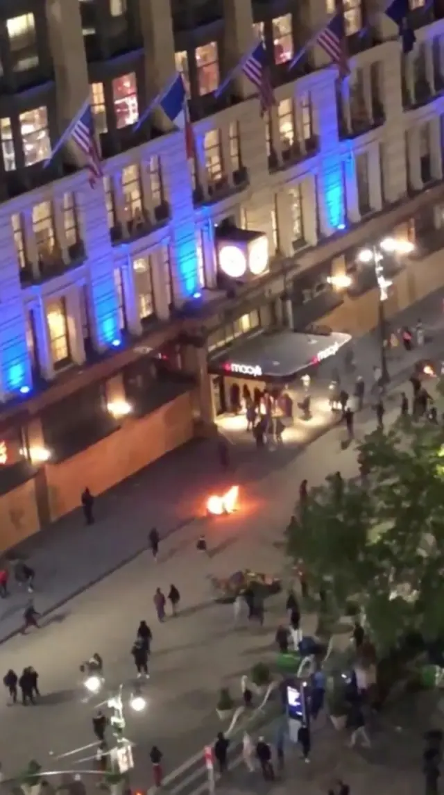 A fire seen outside Macy's as looters target the store