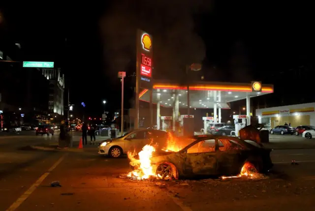 A car burns in St Louis, Missouri, early on Tuesday morning