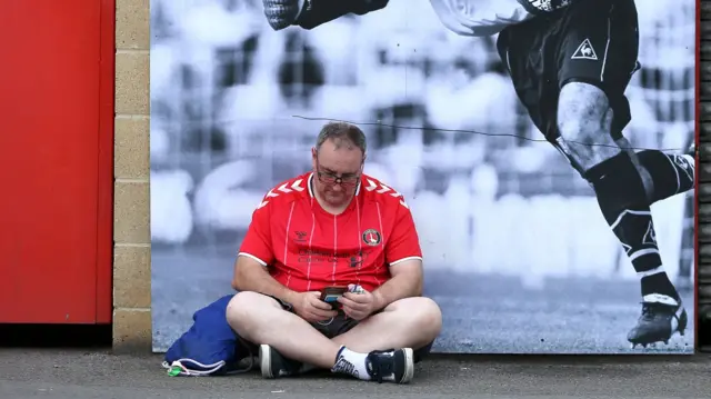 Charlton fan on phone