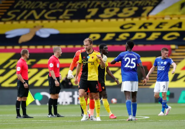 Craig Dawson of Watford interacts with Wilfred Ndidi of Leicester City at full-time