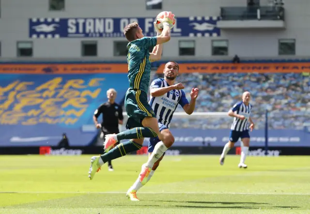 Arsenal's Bernd Leno and Brighton's Neal Maupay