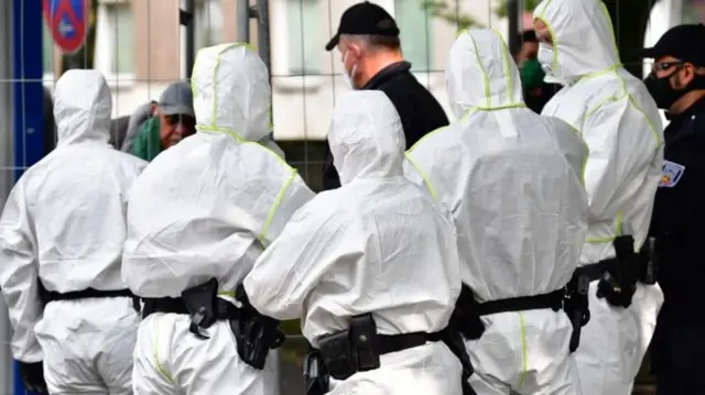 Police wearing protective gear outside the tower block in Göttingen, Germany