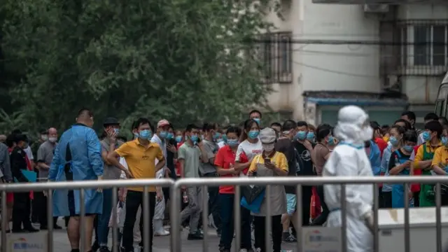 People gather for mass testing in Beijing after a second wave breaks out