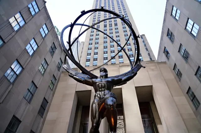 Rockefeller Center Atlas statue is dressed in a mask to coincide with New York City moving into the phase two re-opening from the coronavirus pandemic on 21 June 2020 in New York City