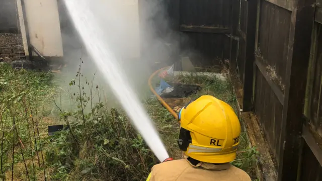 Firefighter tackling a fire