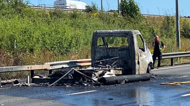 Burnt out truck on the M1