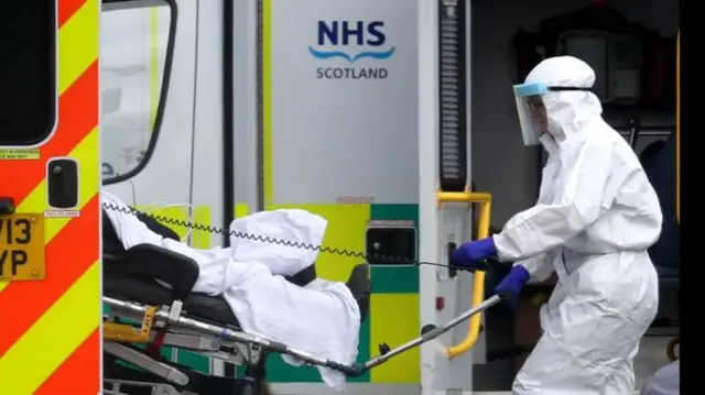 Medics unloading a patient from an ambulance in Scotland